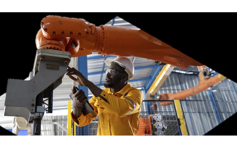 RS Group PLC engineer inspecting industrial equipment on the factory floor